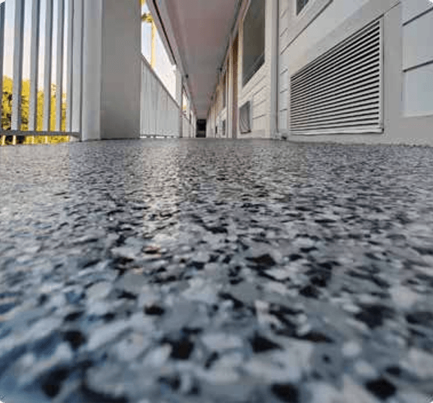 epoxy floor coating in a commercial warehouse garage bay